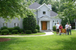 Family By Sold Sign